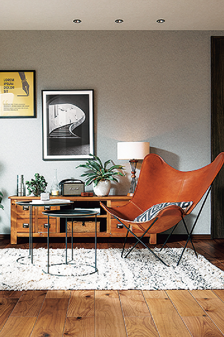 オシャレな部屋にオレンジの大きめの椅子がある写真